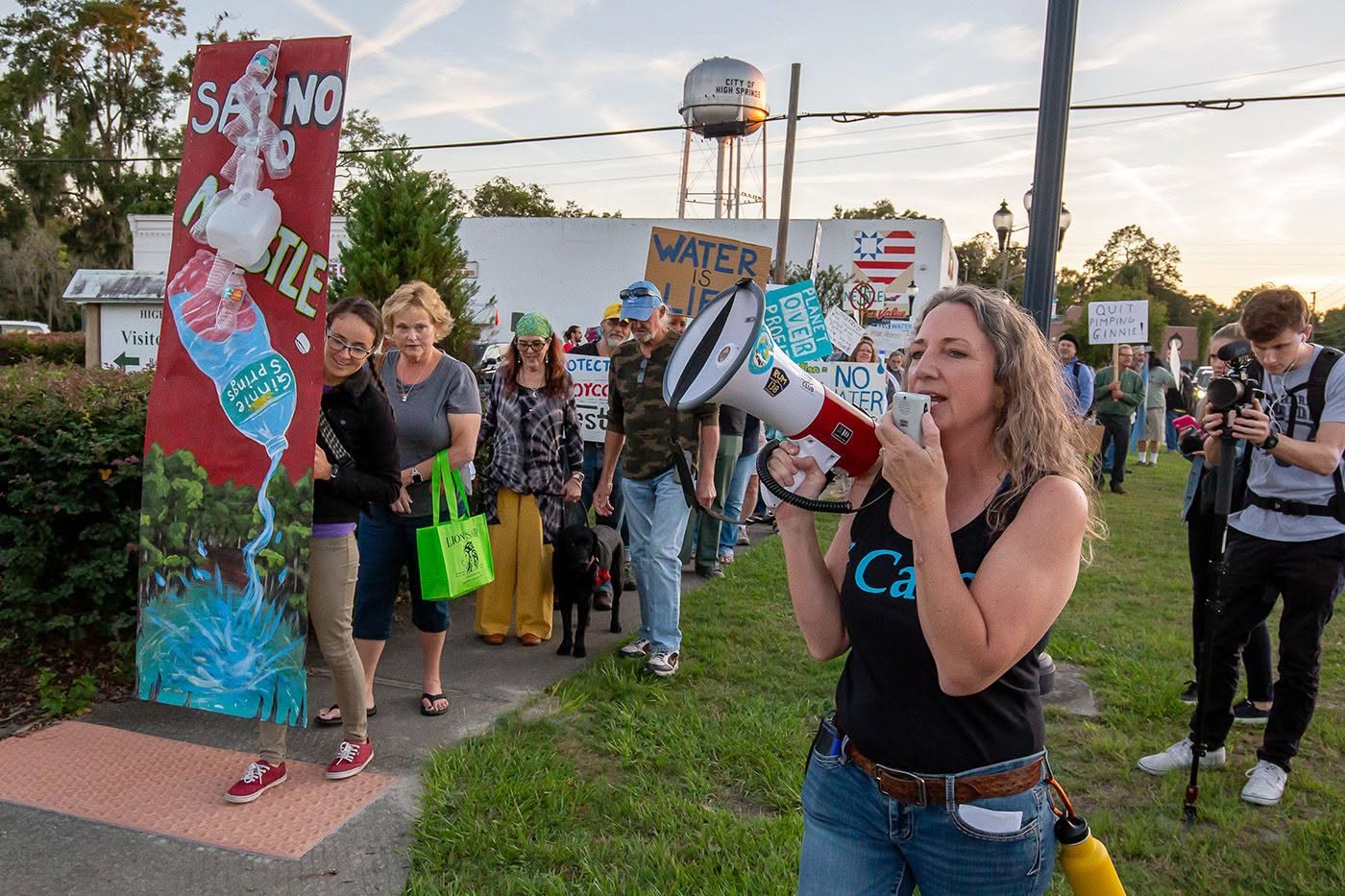 Merrillee with a megaphone at a protest against bottled water withdrawals