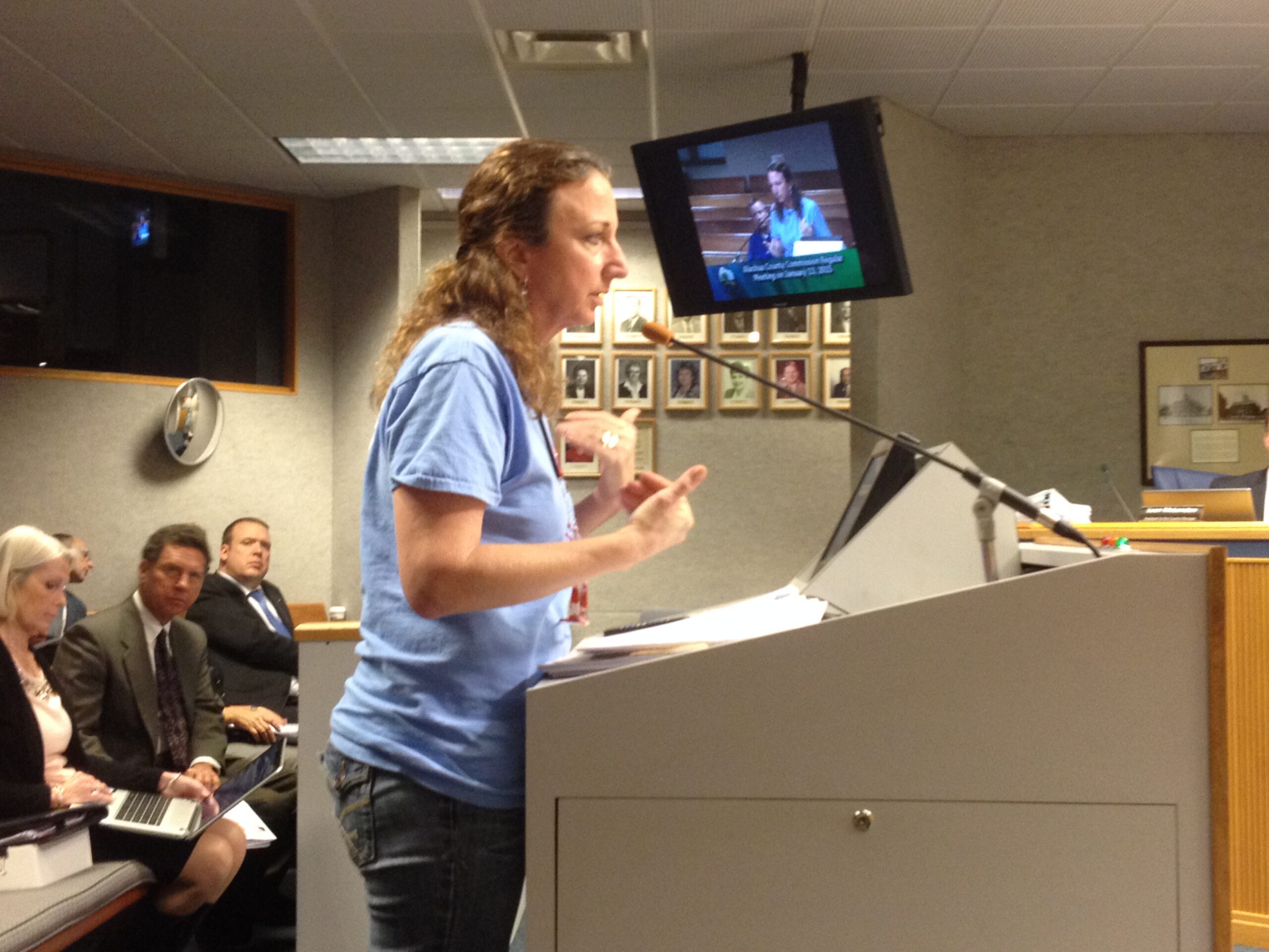 Merrillee testifying at a public hearing