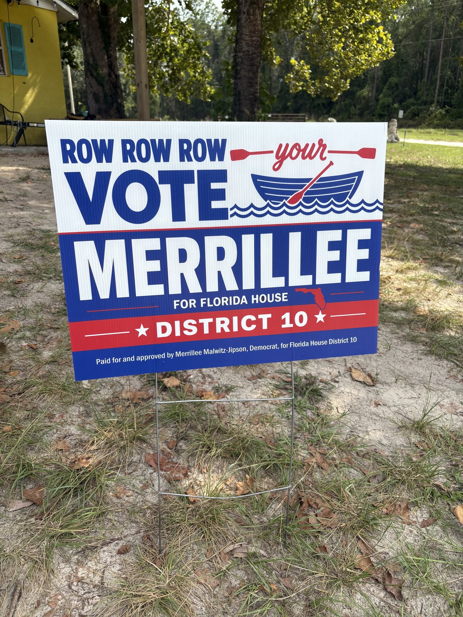 A Row Row Row Your Vote yard sign on a county road